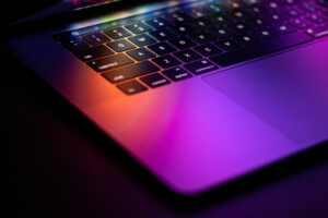 laptop with colourful glowing reflection